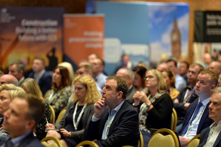 Attendee's watch on as the presentations for Session 4 begin Construction Frameworks Conference, Kensington Town Hall. 02.10.19