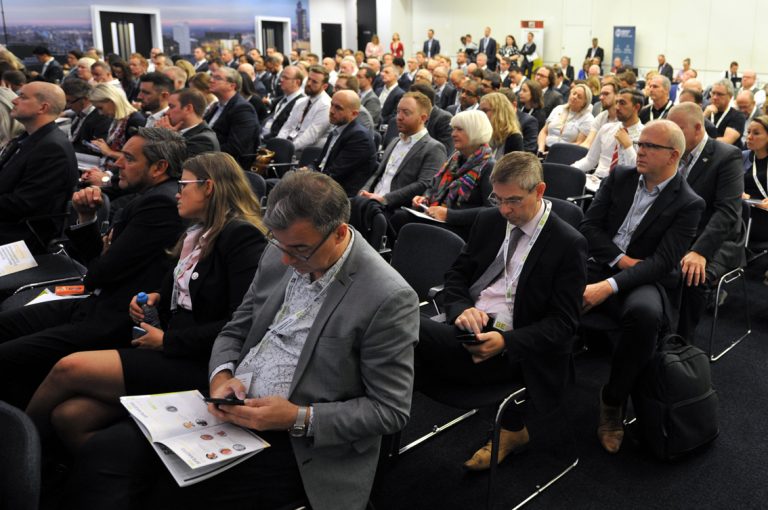 Attendees-take-notes-on-their-phones-Greater-Manchester-Development-Conference-2019