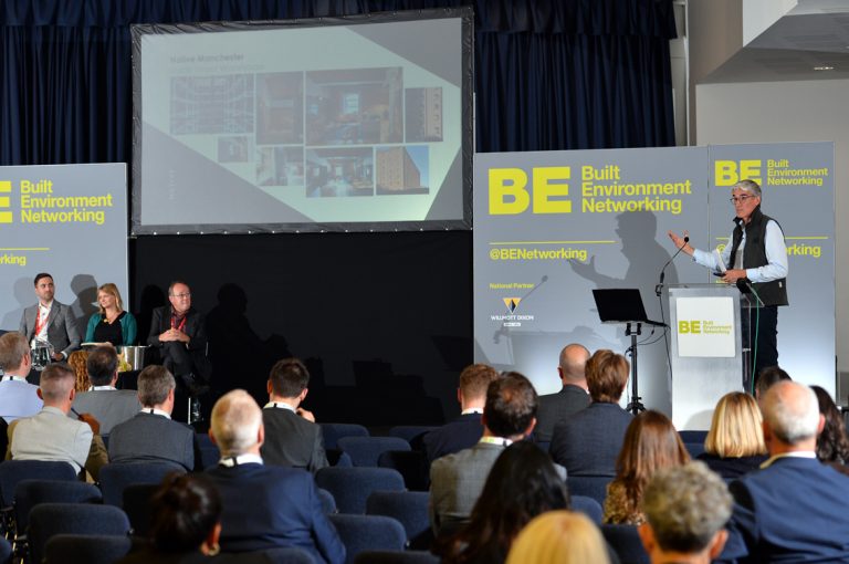 Guy-Dixon-stands-to-present-at-Greater-Manchester-Development-Conference-2019