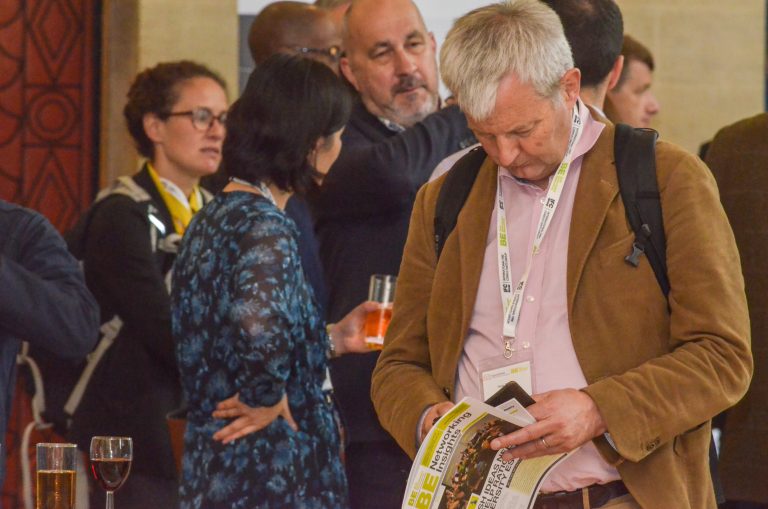 Bristol Development Plans 2019 Attendee checks the magazine for upcoming events