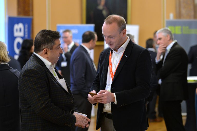 Simon Toplass speaks to an attendee and trades contact details North West Development Confernce, Liverpool.10.12.19