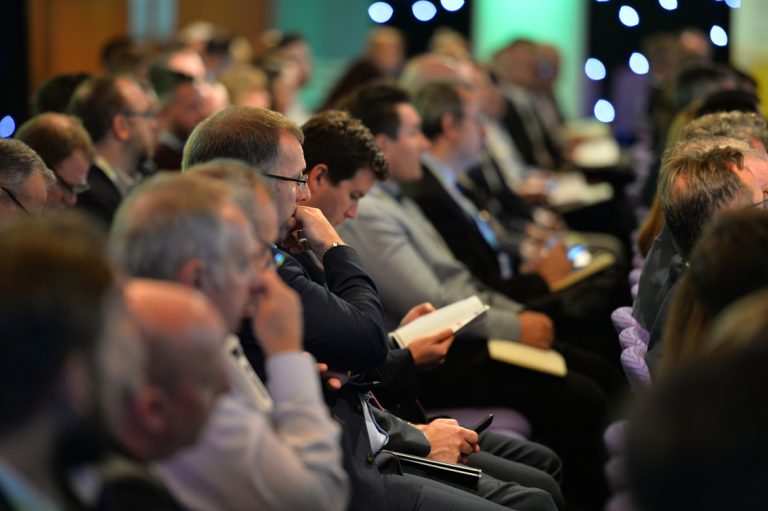 Attendee's watch on as the Panel takes questions