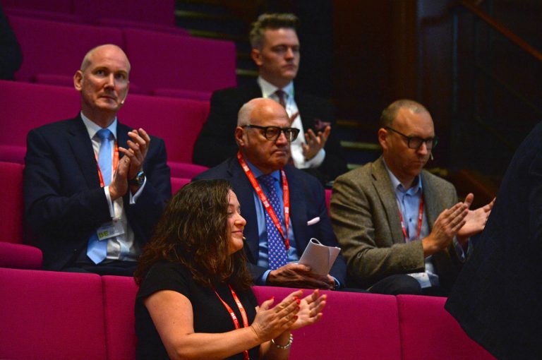 Speakers watch on as their colleagues take the floor London Property Club 2019